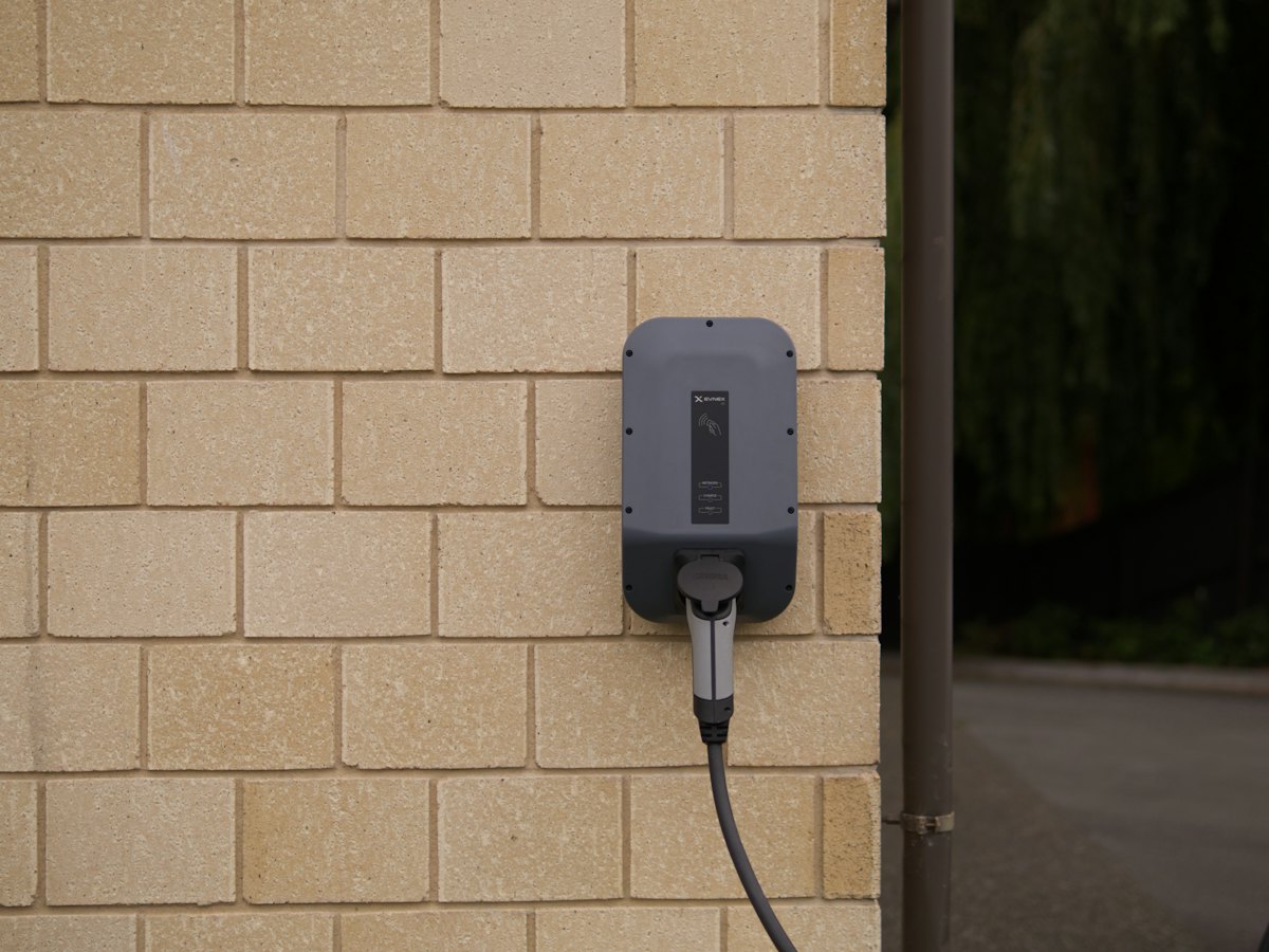 Home EV charger installed on a driveway